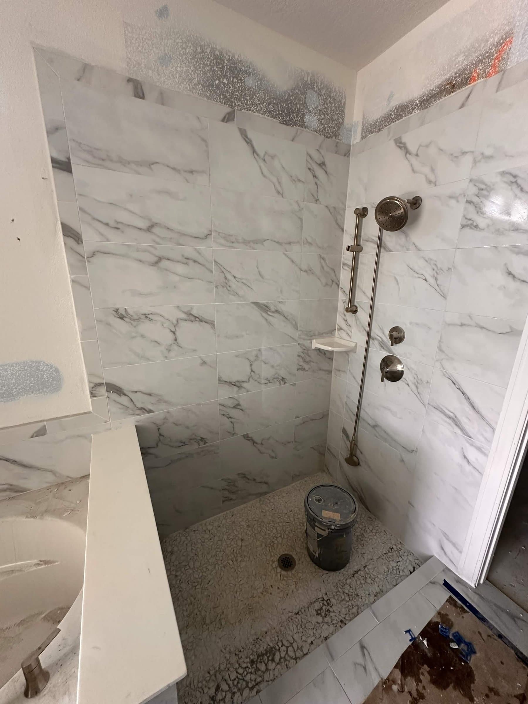 Marble shower installation by KR Flooring