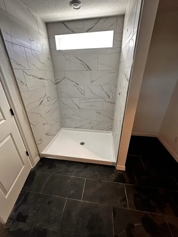 Skylight Shower by KR Flooring